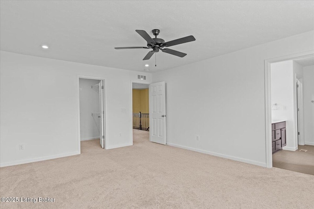 11210 Remembrance Ln, Louisville, KY 40229 - unfurnished bedroom with carpet flooring, a walk in closet, recessed lighting, connected bathroom, and a closet