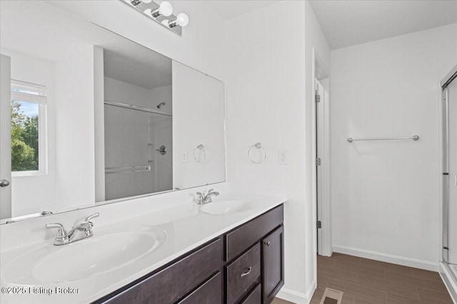 11210 Remembrance Ln, Louisville, KY 40229 - bathroom featuring a stall shower and double vanity