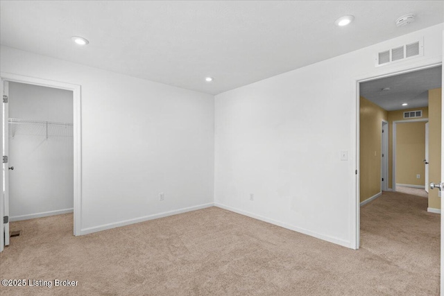 11210 Remembrance Ln, Louisville, KY 40229 - unfurnished bedroom with carpet floors, a walk in closet, recessed lighting, and a closet