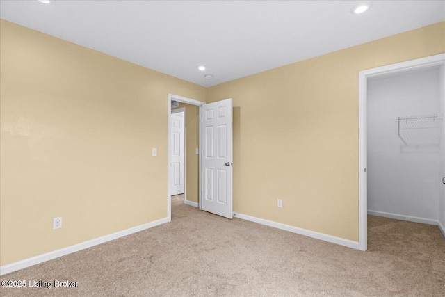 11210 Remembrance Ln, Louisville, KY 40229 - unfurnished bedroom with carpet flooring, a spacious closet, recessed lighting, and a closet