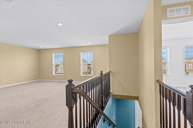 11210 Remembrance Ln, Louisville, KY 40229 - corridor featuring an upstairs landing, a textured ceiling, carpet floors, and recessed lighting