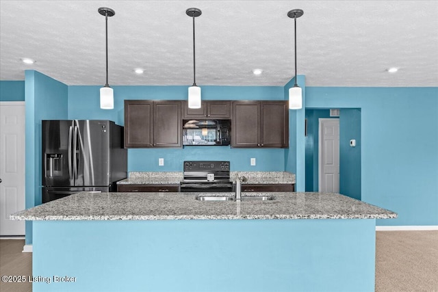 11210 Remembrance Ln, Louisville, KY 40229 - kitchen with black appliances, dark brown cabinetry, a center island with sink, a textured ceiling, and pendant lighting