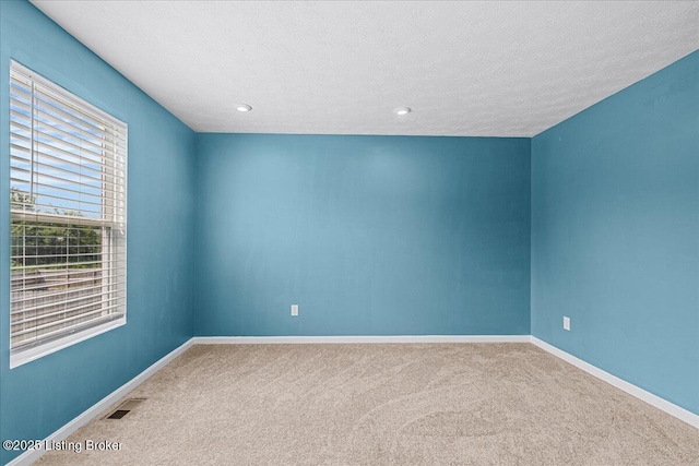 11210 Remembrance Ln, Louisville, KY 40229 - spare room with carpet, a textured ceiling, and recessed lighting