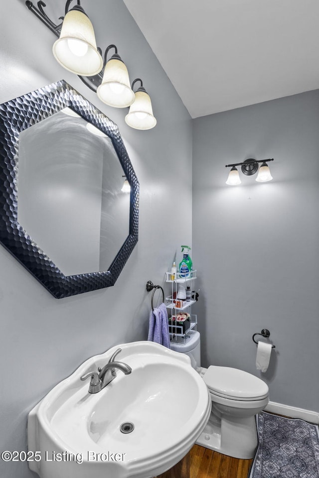 17411 Polo Run Ln, Louisville, KY 40245 - half bathroom with a sink, toilet, and baseboards