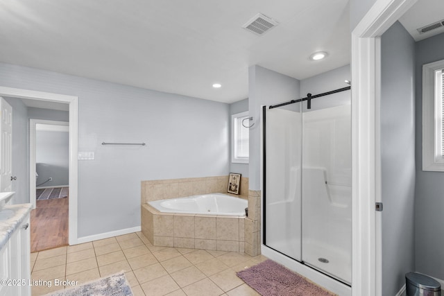 17411 Polo Run Ln, Louisville, KY 40245 - bathroom featuring tile patterned flooring, a garden tub, a stall shower, baseboards, and vanity