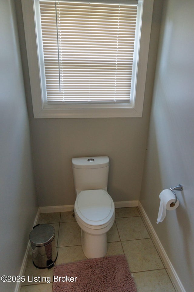 17411 Polo Run Ln, Louisville, KY 40245 - bathroom featuring toilet, healthy amount of natural light, tile patterned floors, and baseboards