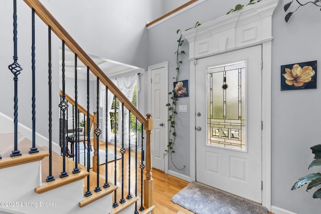 17411 Polo Run Ln, Louisville, KY 40245 - foyer with stairway, light wood-style flooring, and baseboards