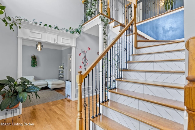 17411 Polo Run Ln, Louisville, KY 40245 - staircase featuring wood finished floors, a high ceiling, and ornamental molding