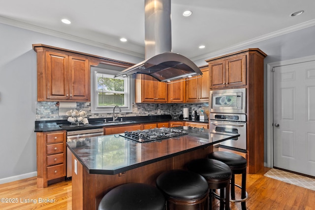17411 Polo Run Ln, Louisville, KY 40245 - kitchen featuring stainless steel appliances, island exhaust hood, a sink, dark countertops, and a breakfast bar area