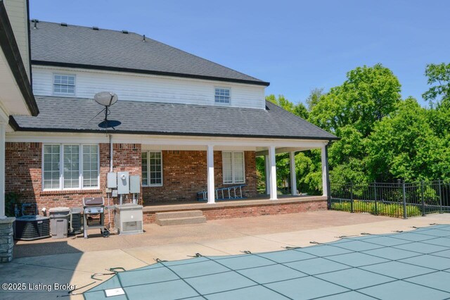 166 Castleton Dr, Bardstown, KY 40004 - rear view of property featuring brick siding, central air condition unit, a patio, and roof with shingles