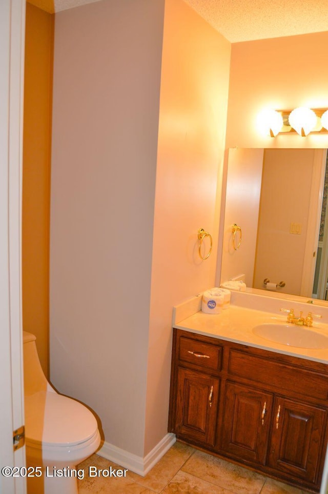 166 Castleton Dr, Bardstown, KY 40004 - bathroom with toilet, vanity, tile patterned flooring, and baseboards