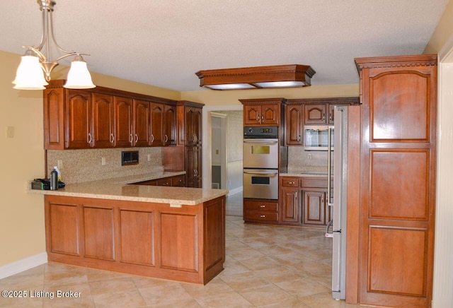 166 Castleton Dr, Bardstown, KY 40004 - kitchen featuring appliances with stainless steel finishes, a peninsula, tasteful backsplash, light countertops, and a textured ceiling