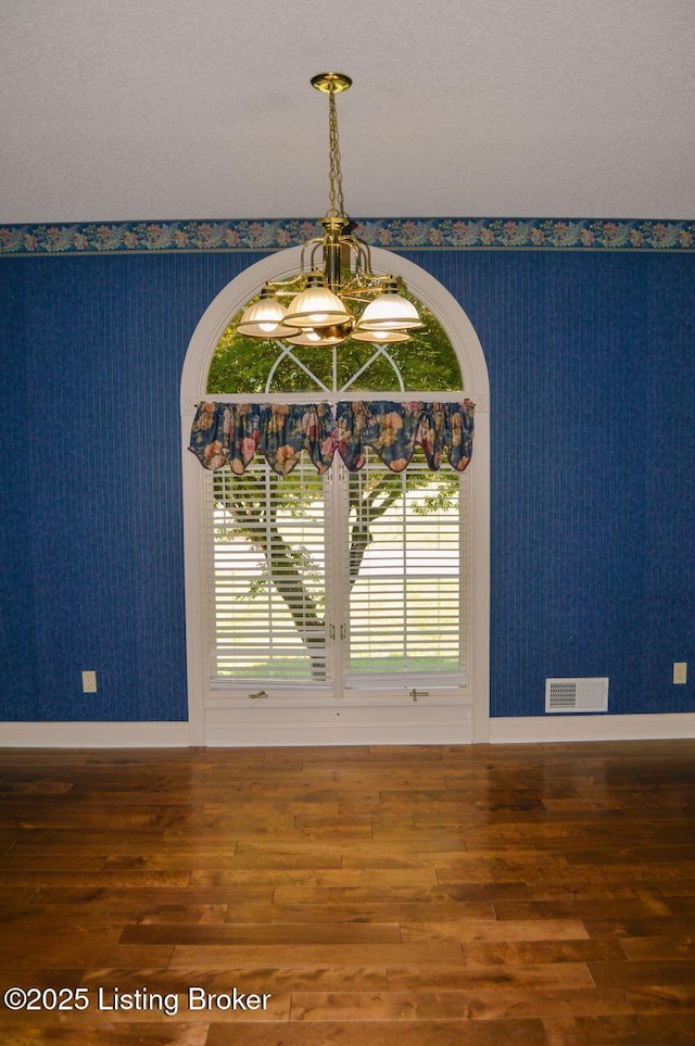 166 Castleton Dr, Bardstown, KY 40004 - detailed view of wallpapered walls, wood finished floors, a chandelier, and baseboards
