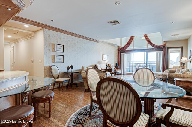 1 Riverpointe Plz Unit 1112, Jeffersonville, IN 47130 - dining area featuring ornamental molding, wood finished floors, and wallpapered walls