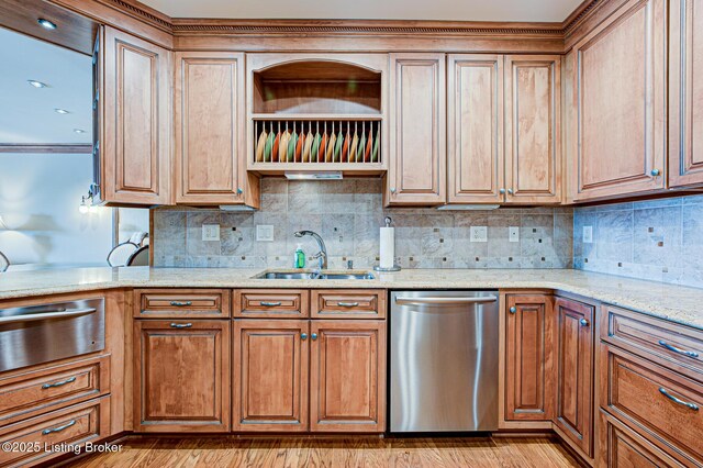 1 Riverpointe Plz Unit 1112, Jeffersonville, IN 47130 - kitchen with dishwasher, a sink, a warming drawer, light stone countertops, and backsplash