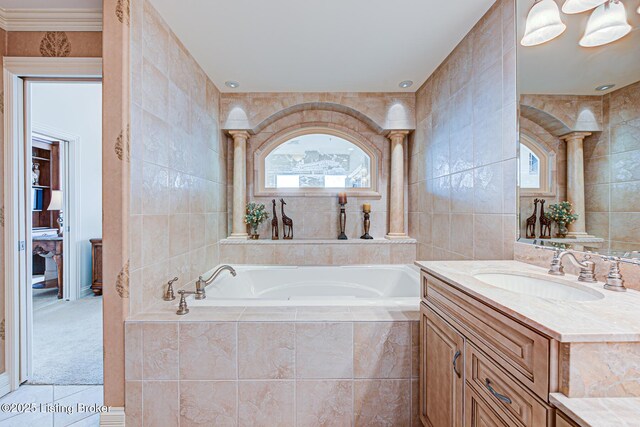 1 Riverpointe Plz Unit 1112, Jeffersonville, IN 47130 - full bathroom featuring tile walls, a garden tub, vanity, tile patterned floors, and plenty of natural light
