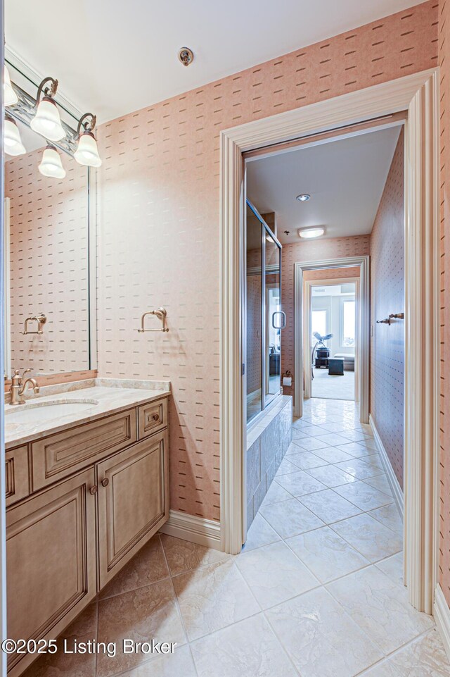 1 Riverpointe Plz Unit 1112, Jeffersonville, IN 47130 - full bathroom with vanity, tile patterned floors, baseboards, and enclosed tub / shower combo
