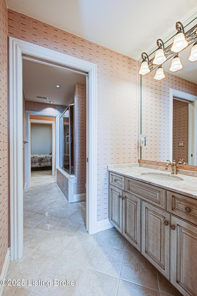 1 Riverpointe Plz Unit 1112, Jeffersonville, IN 47130 - full bath featuring vanity, a chandelier, and baseboards