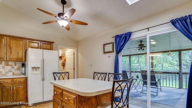 1625 Tina Ct, La Grange, KY 40031 - kitchen with white refrigerator with ice dispenser, a ceiling fan, brown cabinets, and lofted ceiling