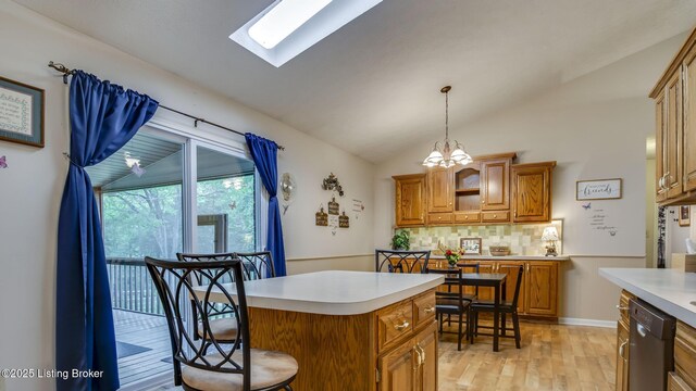 1625 Tina Ct, La Grange, KY 40031 - kitchen featuring dishwasher, light countertops, vaulted ceiling, backsplash, and light wood finished floors