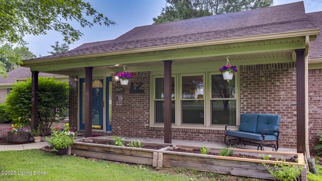 1625 Tina Ct, La Grange, KY 40031 - view of front facade with brick siding and a porch