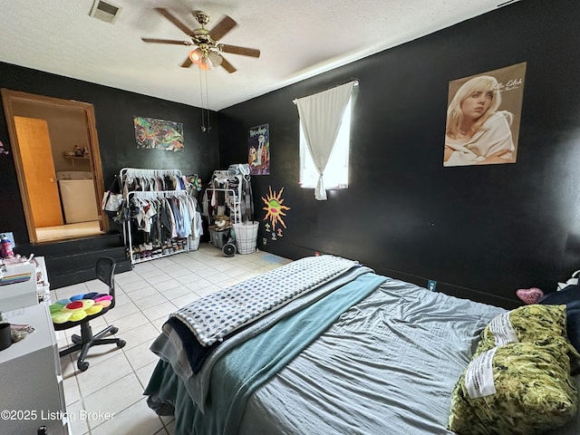 186 Lillian Ave, Elizabethtown, KY 42701 - tiled bedroom featuring a textured ceiling, washer / dryer, and ceiling fan
