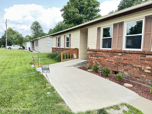 186 Lillian Ave, Elizabethtown, KY 42701 - view of front facade with brick siding and a front yard