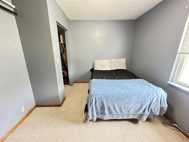 186 Lillian Ave, Elizabethtown, KY 42701 - carpeted bedroom with a textured ceiling and baseboards