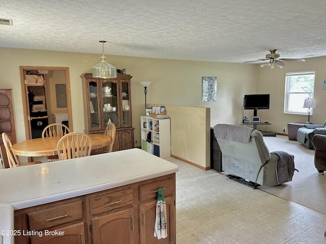 186 Lillian Ave, Elizabethtown, KY 42701 - kitchen with light flooring, ceiling fan, light countertops, a textured ceiling, and decorative light fixtures