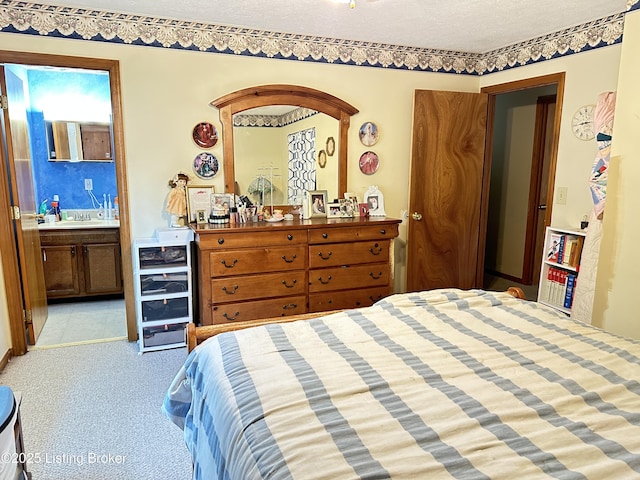 186 Lillian Ave, Elizabethtown, KY 42701 - bedroom featuring bar with sink, a textured ceiling, ensuite bathroom, and carpet flooring