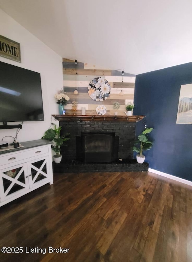 3007 Cline Ct, Carrollton, KY 41008 - living room featuring wood finished floors, a fireplace with raised hearth, and baseboards