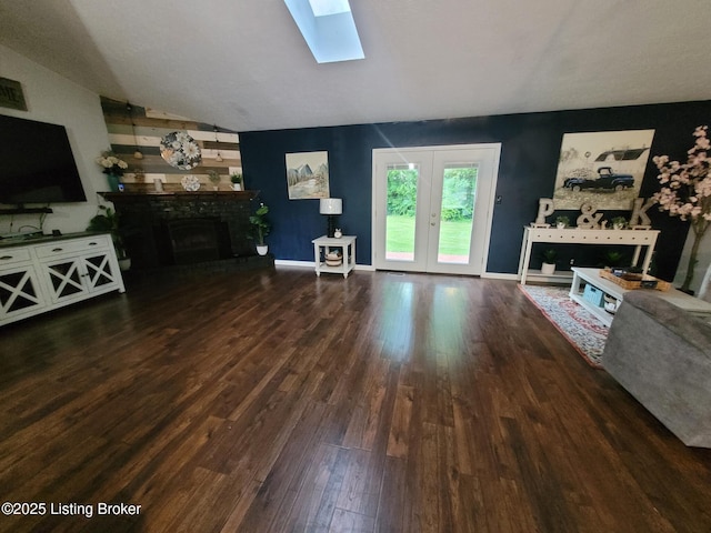 3007 Cline Ct, Carrollton, KY 41008 - living room featuring a fireplace, wood finished floors, a skylight, lofted ceiling, and baseboards