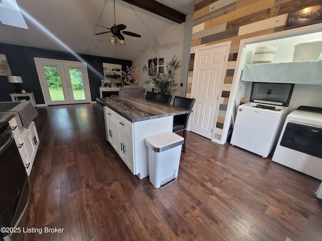 3007 Cline Ct, Carrollton, KY 41008 - kitchen featuring dark wood-style flooring, white cabinetry, washing machine and clothes dryer, open floor plan, and dark countertops