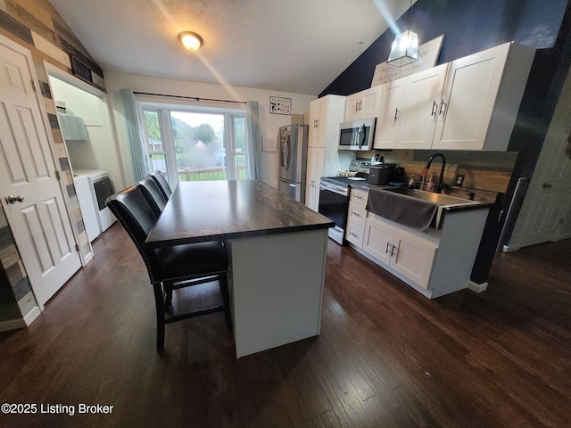 3007 Cline Ct, Carrollton, KY 41008 - kitchen featuring lofted ceiling, appliances with stainless steel finishes, a sink, white cabinets, and dark wood-type flooring