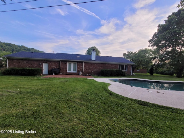 3007 Cline Ct, Carrollton, KY 41008 - rear view of property with brick siding, a yard, a patio, and a chimney