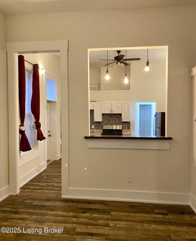 809 S Shelby St, Louisville, KY 40203 - kitchen with freestanding refrigerator, dark countertops, range, dark wood-type flooring, and ceiling fan
