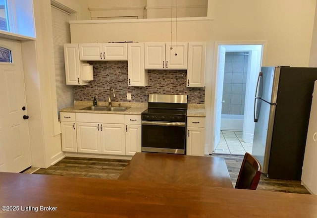 809 S Shelby St, Louisville, KY 40203 - kitchen featuring stainless steel appliances, a sink, and white cabinetry