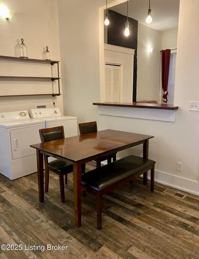 809 S Shelby St, Louisville, KY 40203 - dining room with dark wood-type flooring, washing machine and dryer, and baseboards