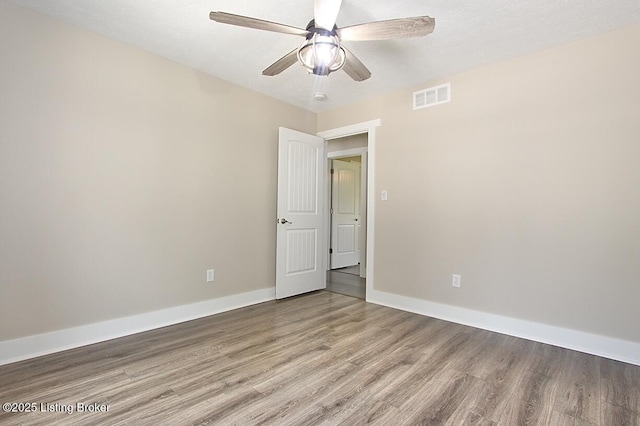 2004 Kepley Rd, Georgetown, IN 47122 - empty room with wood finished floors, baseboards, and a ceiling fan