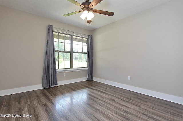2004 Kepley Rd, Georgetown, IN 47122 - empty room with dark wood-type flooring, baseboards, and a ceiling fan