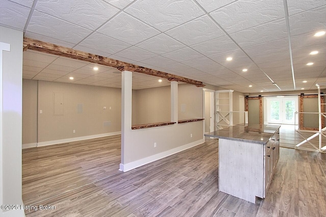 2004 Kepley Rd, Georgetown, IN 47122 - kitchen with a barn door, baseboards, recessed lighting, light wood finished floors, and a center island