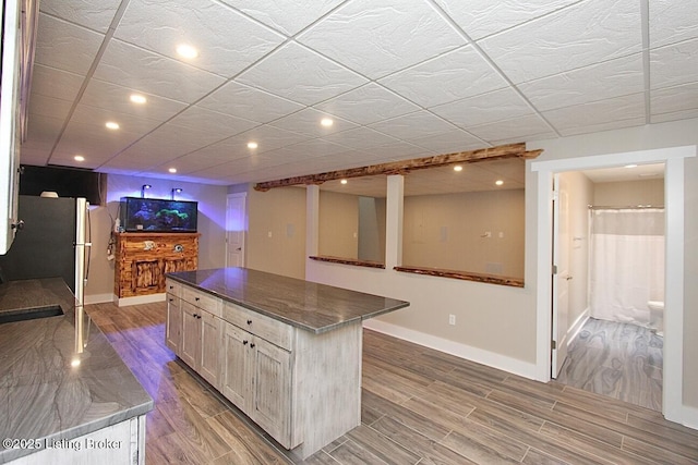2004 Kepley Rd, Georgetown, IN 47122 - kitchen with light wood-type flooring, recessed lighting, baseboards, and a center island