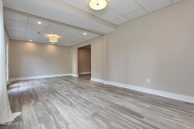 2004 Kepley Rd, Georgetown, IN 47122 - spare room featuring wood finished floors, a paneled ceiling, baseboards, and recessed lighting