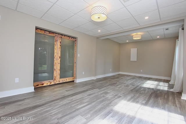 2004 Kepley Rd, Georgetown, IN 47122 - empty room featuring wood finished floors, baseboards, and a drop ceiling