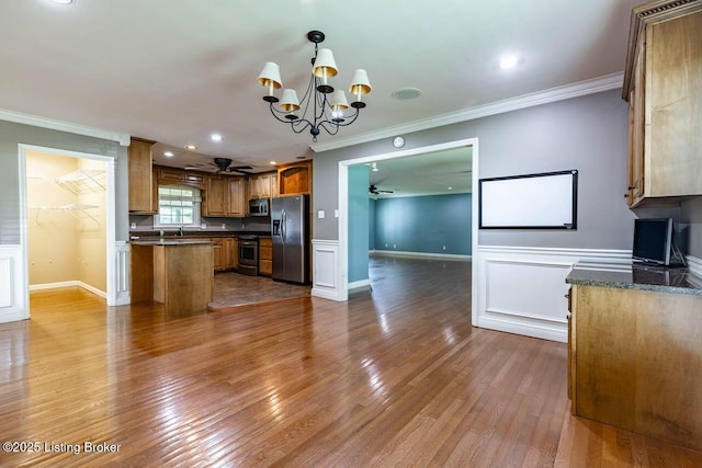 766 Pottershop Rd, Bardstown, KY 40004 - kitchen with appliances with stainless steel finishes, ceiling fan, brown cabinets, ornamental molding, and a chandelier