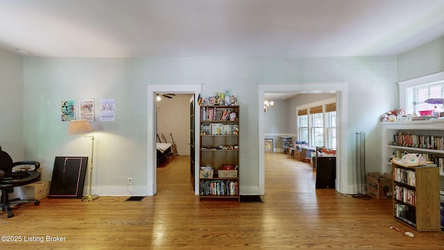 1344 S Brook St, Louisville, KY 40208 - interior space featuring wood finished floors, plenty of natural light, and baseboards