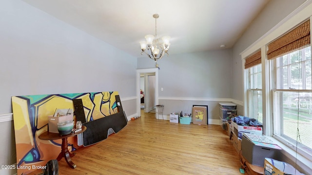1344 S Brook St, Louisville, KY 40208 - dining room featuring wood finished floors, a chandelier, and baseboards