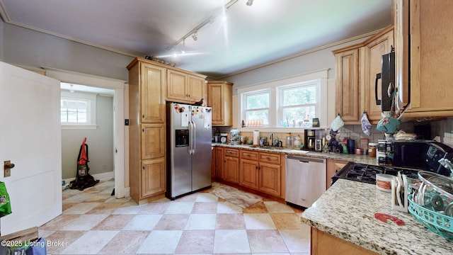 1344 S Brook St, Louisville, KY 40208 - kitchen with appliances with stainless steel finishes, plenty of natural light, light stone countertops, track lighting, and ornamental molding