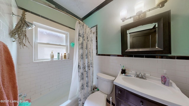 1344 S Brook St, Louisville, KY 40208 - full bathroom featuring toilet, vanity, tile walls, shower / tub combo, and a wainscoted wall