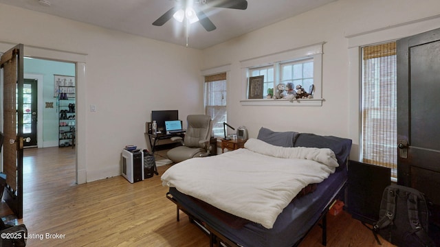 1344 S Brook St, Louisville, KY 40208 - bedroom with light wood-style flooring, baseboards, and ceiling fan